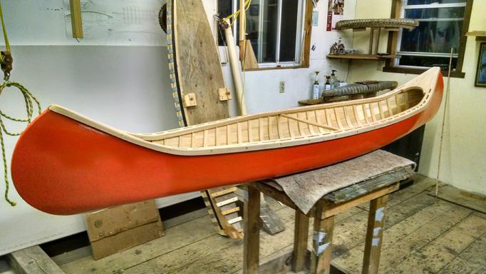 Orange 8 foot display canoes